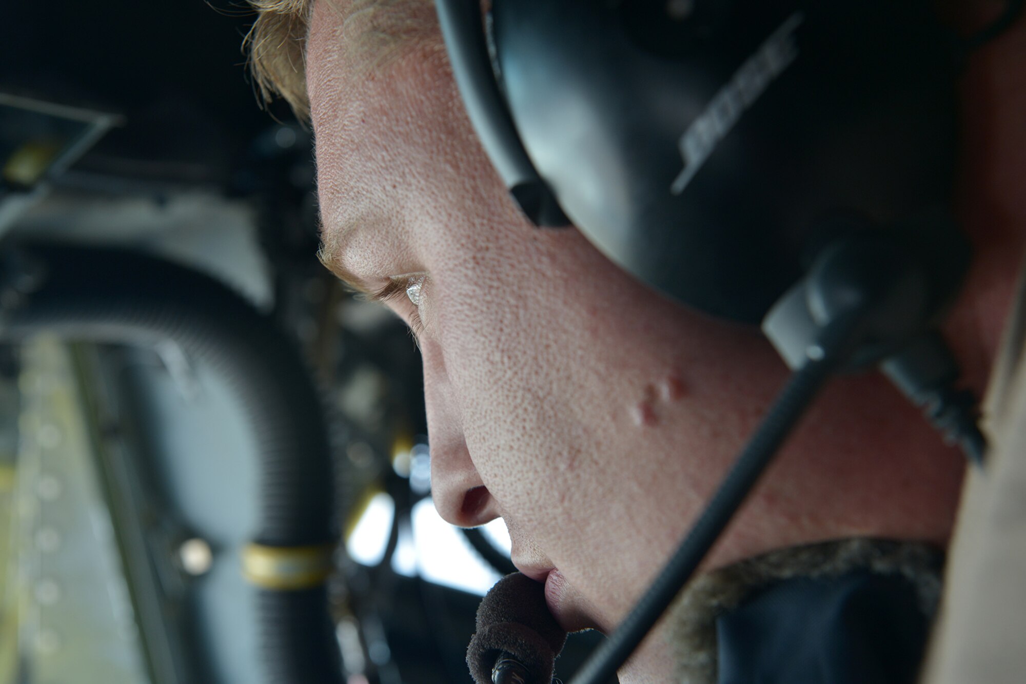 U.S. Air Force Staff Sgt. Reggie Reese, 340th Expeditionary Air Refueling Squadron boom operator, looks out over Afghanistan June 20, 2014. As the boom operator, Reese is responsible for refueling other aircraft while in flight. Reese is from Pittsburgh. (U.S. Air Force photo by Staff Sgt. Ciara Wymbs)  