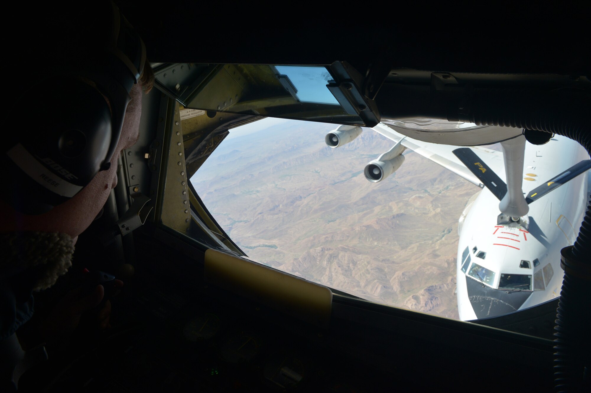 U.S. Air Force Staff Sgt. Reggie Reese, 340th Expeditionary Air Refueling Squadron boom operator, refuels an E-3 Sentry over Afghanistan skies June 20, 2014. The boom operator’s responsibility is to safely and effectively refuel other aircraft while in flight. Reese hails from Pittsburgh. (U.S. Air Force photo by Staff Sgt. Ciara Wymbs)  