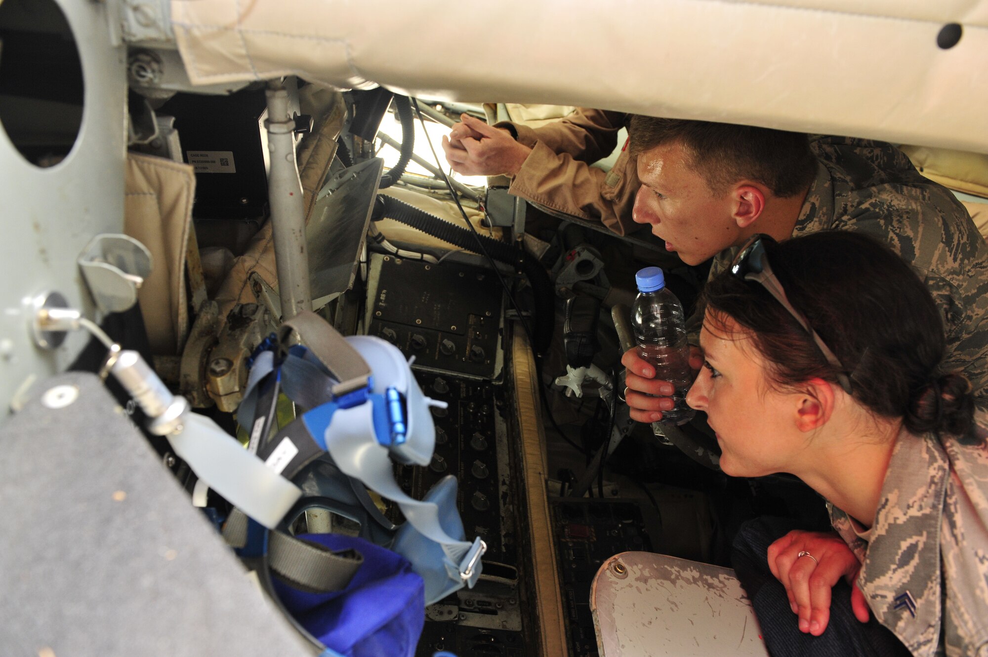 U.S. Air Force Senior Airman Shawn Gallasher, 340th Air Refueling Squadron boom operator, explains the controls and general operations of the boom on a KC-135 to U.S. Air Force Academy cadets during a visit at Al Udeid Air Base, Qatar, June 16, 2014. More than 19 USAFA cadets visited the 379th Air Expeditionary Wing in June to observe deployed operations first-hand and interact with deployed U.S. and Coalition forces. Gallasher is deployed from MacDill Air Force Base, Florida. (U.S. Air Force photo by Senior Airman Colin Cates)