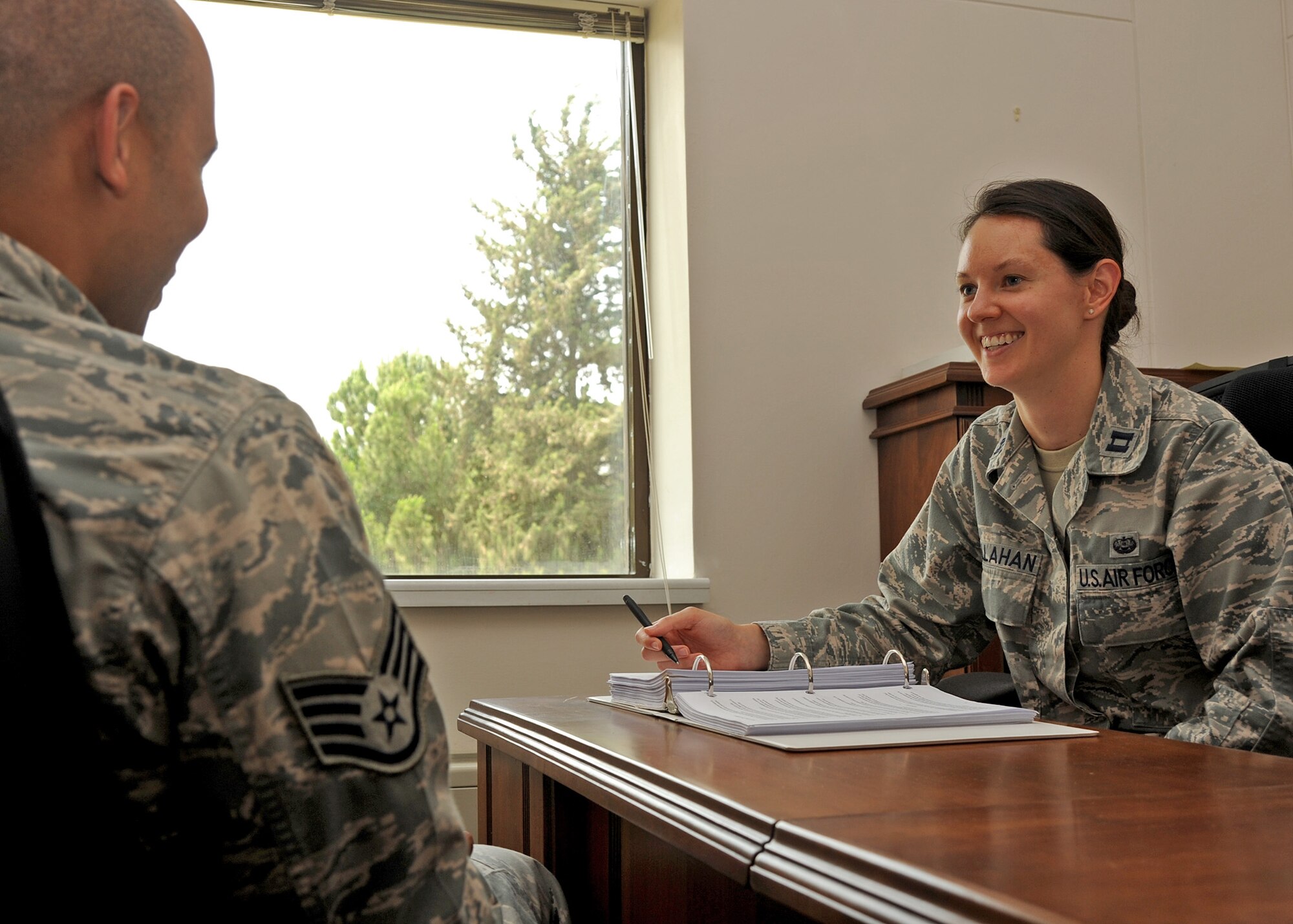 Capt. Lindsey Callahan, 39th Air Base Wing Legal Office chief of military justice, discusses the Uniformed Code of Military Justice with Staff Sgt. Jason Murphy, 39th Air Base Wing Legal Office Military Justice Paralegal, June 19, 2014, Incirlik Air Base, Turkey. The legal office here is available to assist with legal concerns, and offer legal guidance to service members and their dependents station at Incirlik AB. (U.S. Air Force photo by Staff Sgt. Veronica Pierce) 