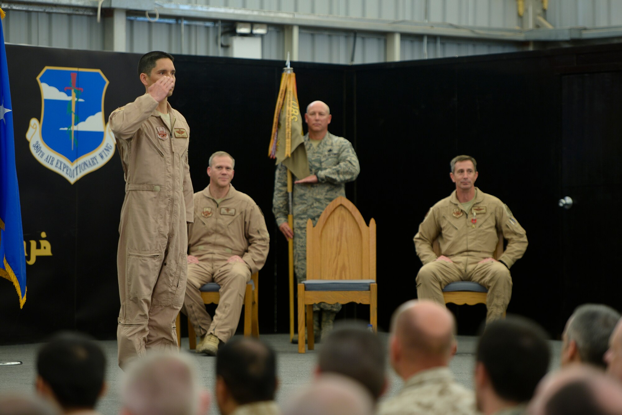 Brig. Gen. John Quintas, 380th Air Expeditionary Wing commander, returns his first salute as commander June 18, 2014, at an undisclosed location in Southwest Asia. Quintas succeeded Brig. Gen. Kevin Schneider as wing commander. (U.S. Air Force photo by Tech. Sgt. Russ Scalf/Released)