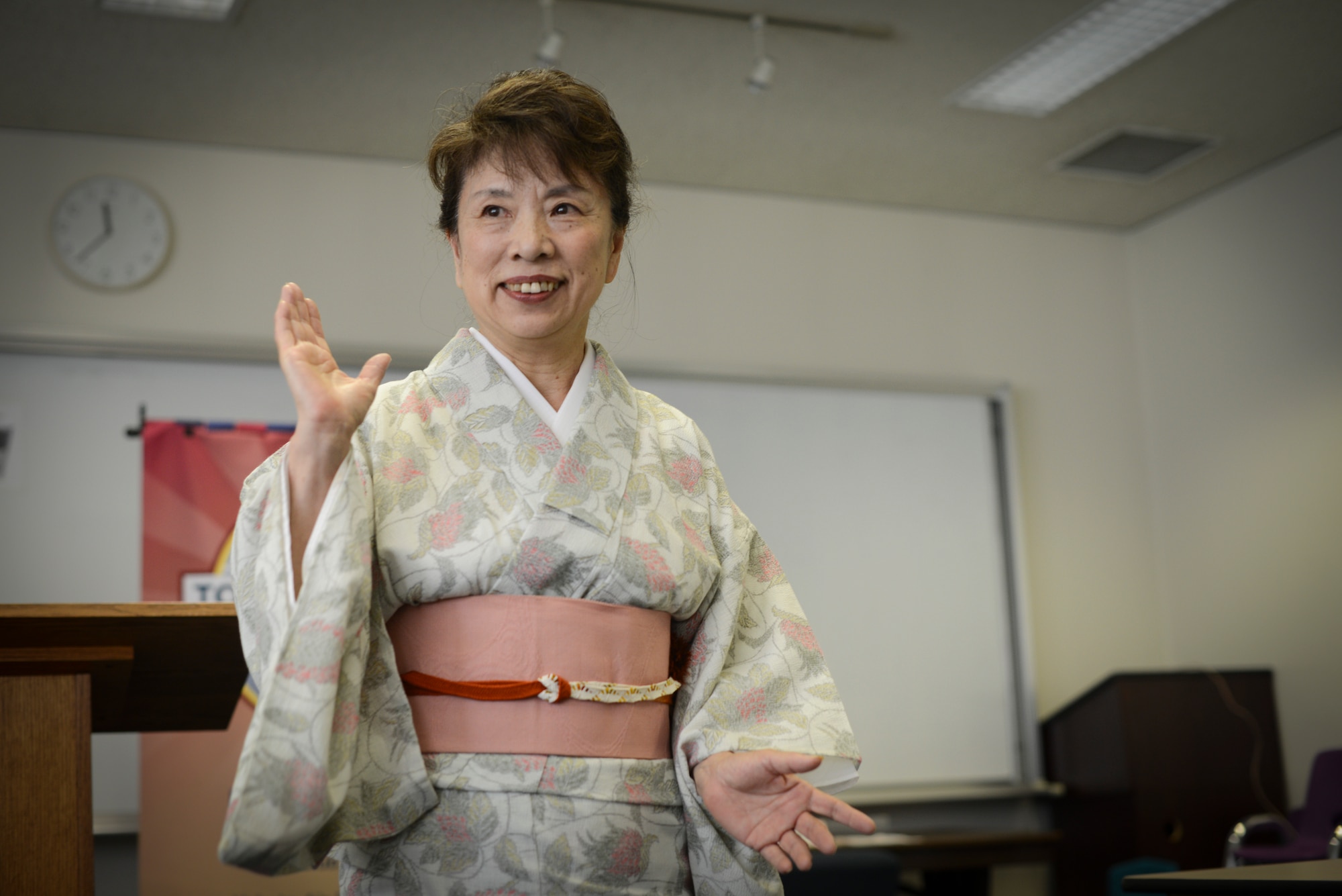 A Fussa Speakers Toastermasters Club member gives a speech during a weekly meeting at Yokota Air Base, Japan, June 20, 2014. Members give speeches and provide advice and guidance to each other to help improve their public speaking skills. (U.S. Air Force photo by Staff Sgt. Cody H. Ramirez/Released)