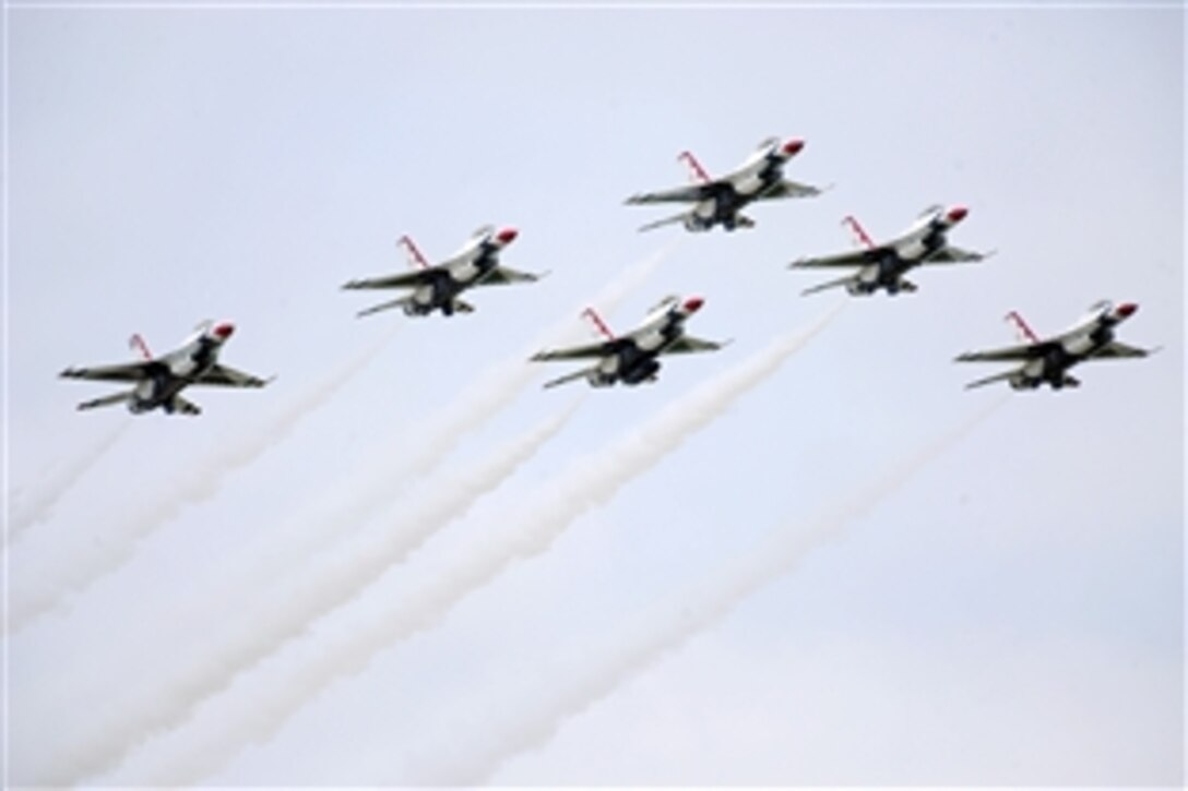 The U.S. Air Force Thunderbirds air demonstration squadron performs the delta flat pass during their performance at Rockford AirFest at Chicago Rockford International Airport, June 8, 2014.