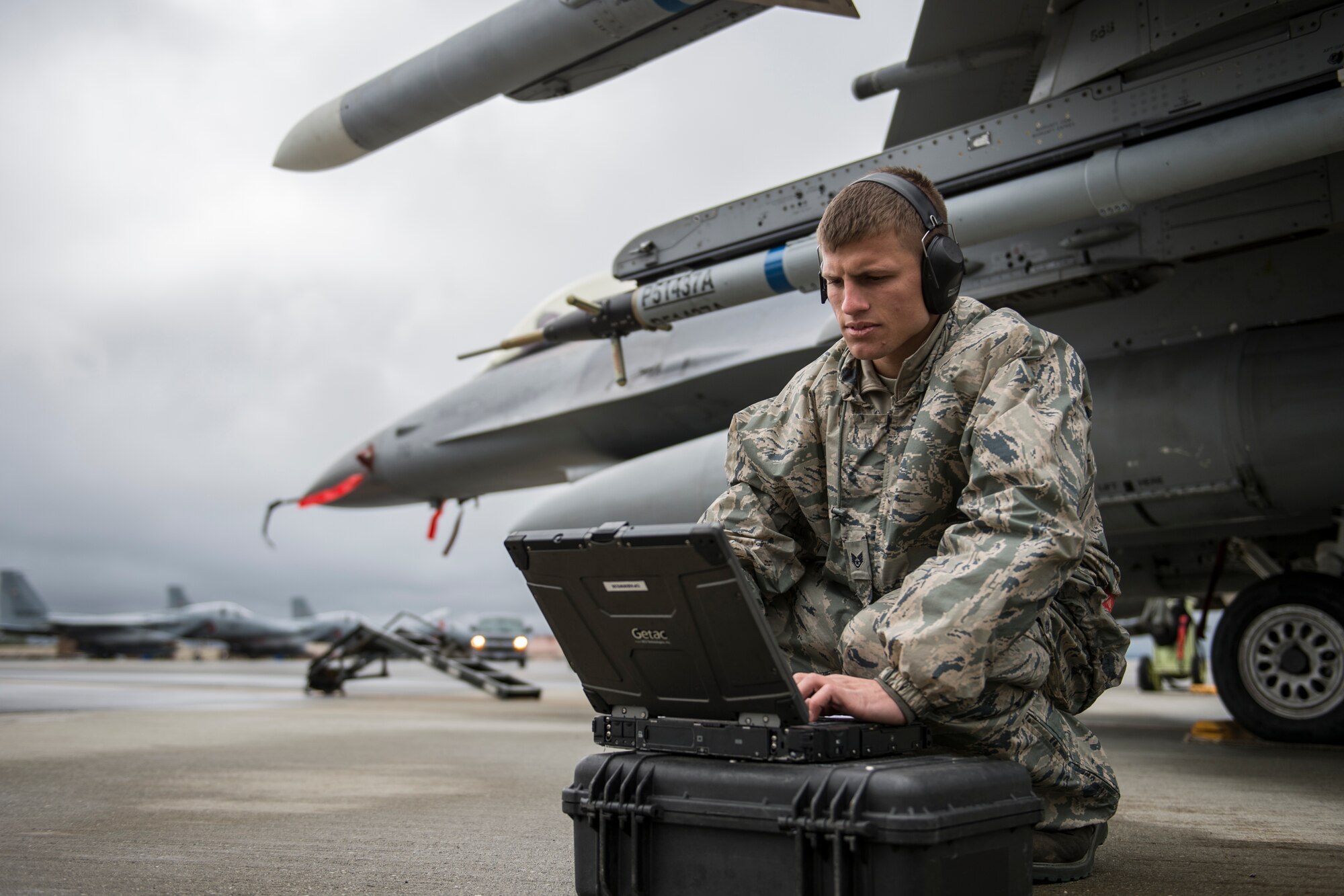 U.S. Air Force Staff Sgt. Zackery Coder, 36th Aircraft Maintenance Unit crew chief assigned to Osan Air Base, South Korea, checks computer data during RED FLAG-Alaska 14-2, June 19, 2014, Eielson Air Force Base, Alaska. Coder ensured the F-16 Fighting Falcon was ready for the next sortie. (U.S. Air Force photo by Senior Airman Peter Reft/Released)