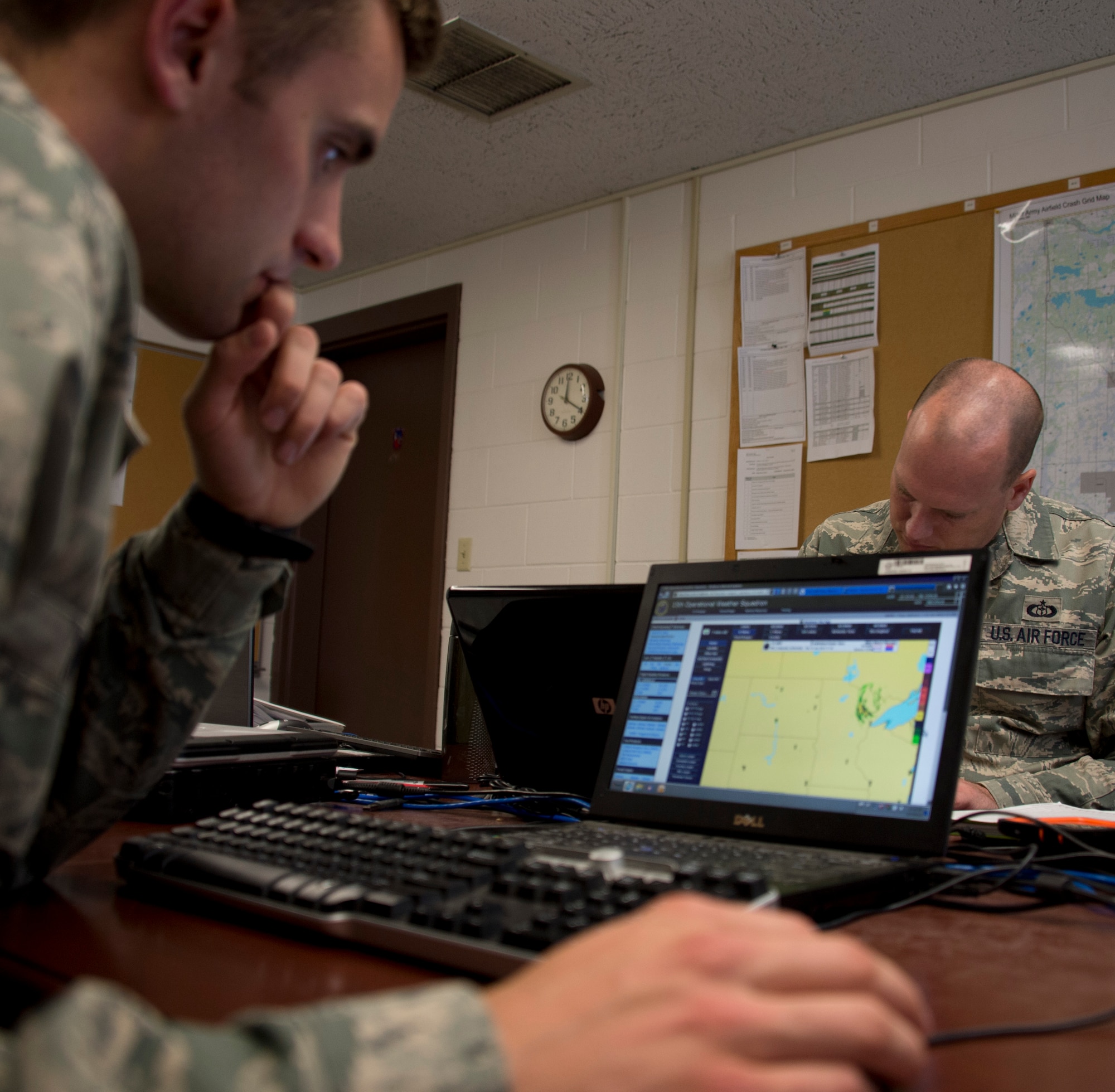 U.S. Air Force Senior Airman Timothy Wigton, 208th Weather Flight, reviews weather conditions over the East Coast while in Little Falls, Minn., June 12, 2014. Wigton is in the last phase of his upgrade skill training during which he was evaluated on his knowledge of weather. 

(U.S. Air National Guard photo by Tech. Sgt. Amy M. Lovgren/Released)