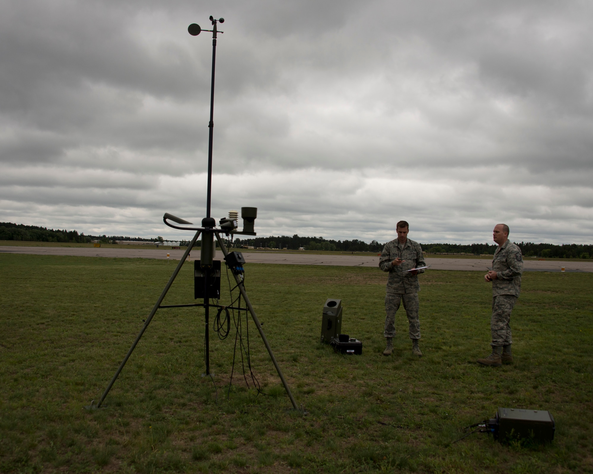U.S. Air Force Master Sgt. James Emery, right, and Senior Airman Timothy Wigton, both from the 208th Weather Flight, collect weather information in Little Falls, Minn., June 12, 2014. Emery and Wigton participated in a training exercise with the Minnesota Army National Guard, Charlie Company, 834th Aviation Support Battalion where they provide up to date weather conditions for the pilots. 

(U.S. Air National Guard photo by Tech. Sgt. Amy M. Lovgren/Released)