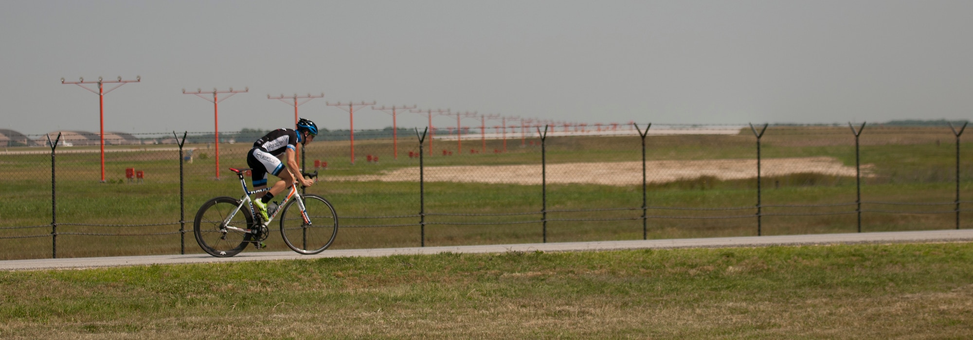 Senior Airman David Flaten, a 811th Security Forces Squadron protective services member and professional cross-country mountain biker, trains June 18, 2014, at Joint Base Andrews, Md. Flaten is ranked 43rd of 250 according to USA Cycling, the official cycling organization responsible for identifying, training and selecting cyclists to represent the United States in international competition. (U.S. Air Force photo/Senior Airman Nesha Humes)