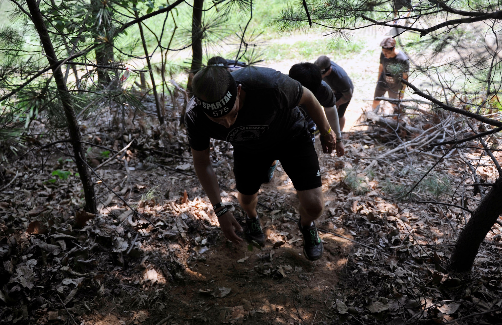 Airman 1st Class Zeke Garschagen, 51st Fighter Wing Judge Advocate military justice paralegal, walks through a forest trail during a Spartan Race in Seoul, Republic of Korea, June 15, 2014. The race was approximately 5 kilometers long. (U.S. Air Force photo/Senior Airman David Owsianka)