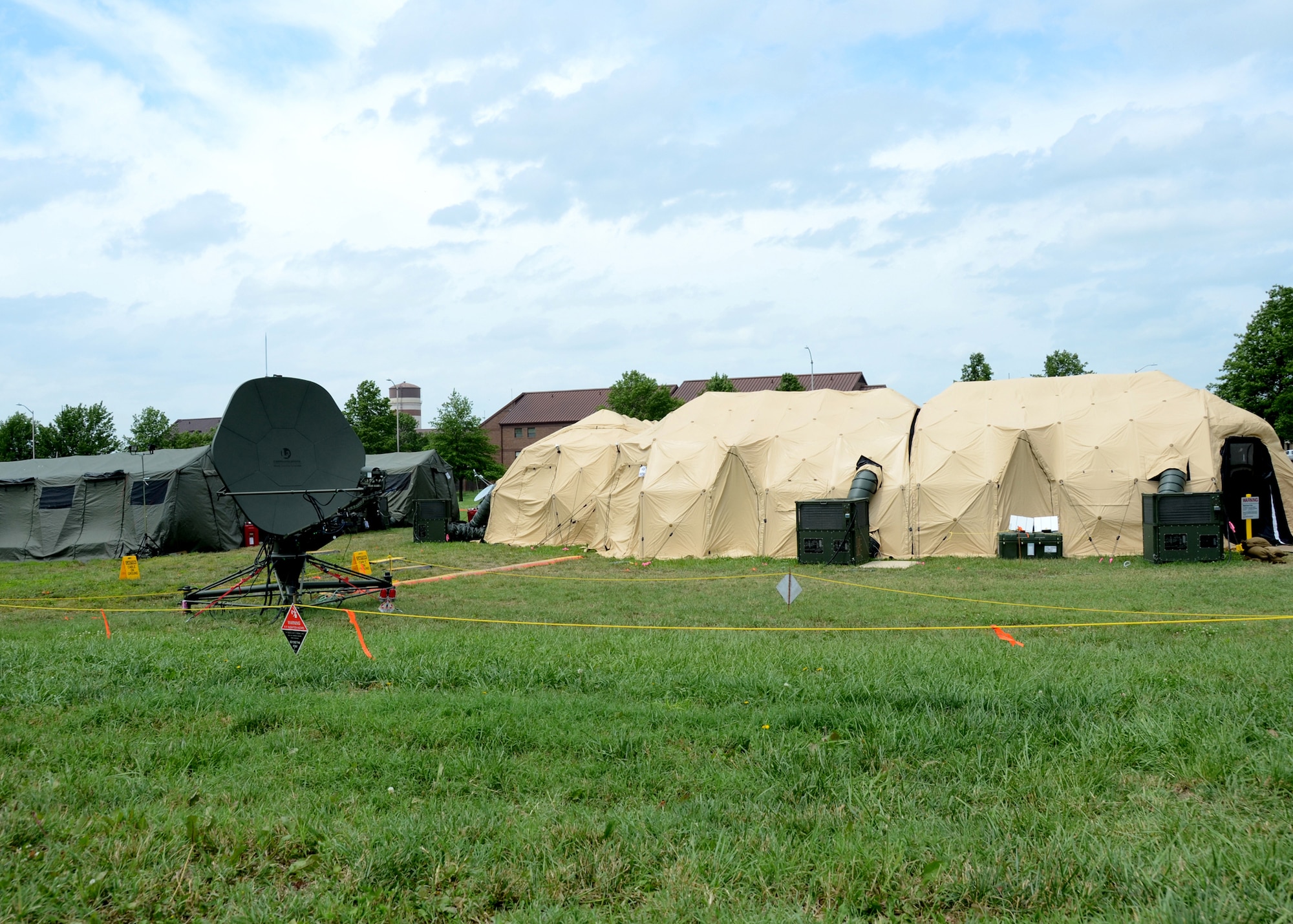 The 239th Combat Communications Squadron, Missouri Air National Guard, “deployed” from Jefferson Barracks, St. Louis, Missouri, to Whiteman Air Force Base, Missouri, for an exercise during the 131st Bomb Wing annual training week, June 16-20, 2014.  They set up tents and employed their mobile communications equipment for a "real-world" experience for all involved in the exercise.. (U.S. Air National Guard photo by Airman Halley Burgess)