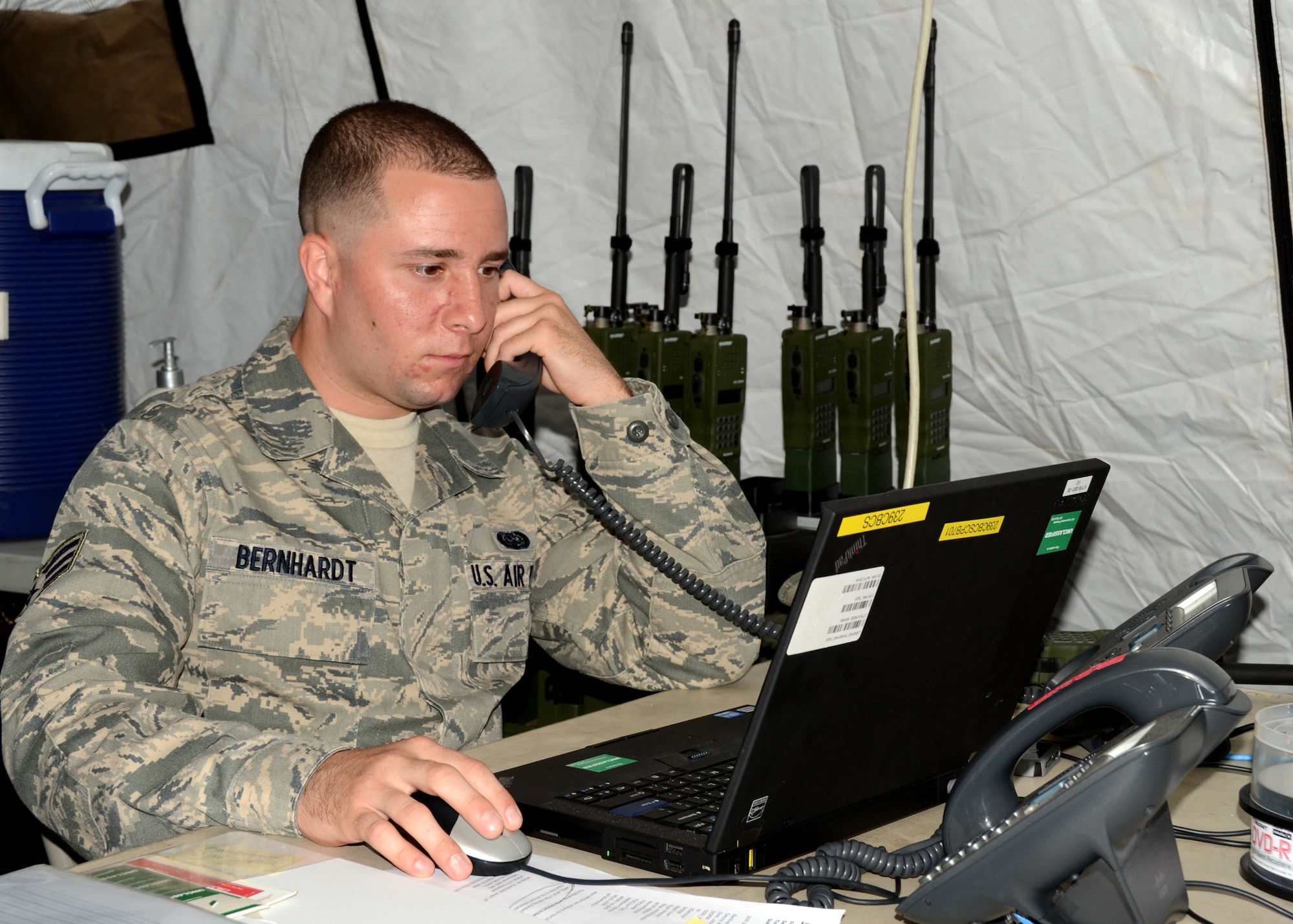 The 239th Combat Communications Squadron, Missouri Air National Guard, “deployed” from Jefferson Barracks, St. Louis, Missouri, to Whiteman Air Force Base, Missouri, for an exercise during the 131st Bomb Wing annual training week, June 16-20, 2014.   Citizen-Airmen of the 131st Bomb Wing Comptroller Flight also participated in the exercise, with members running mock scenarios while using equipment and workspace provided by the 239th. (U.S. Air National Guard photo by Airman Halley Burgess)