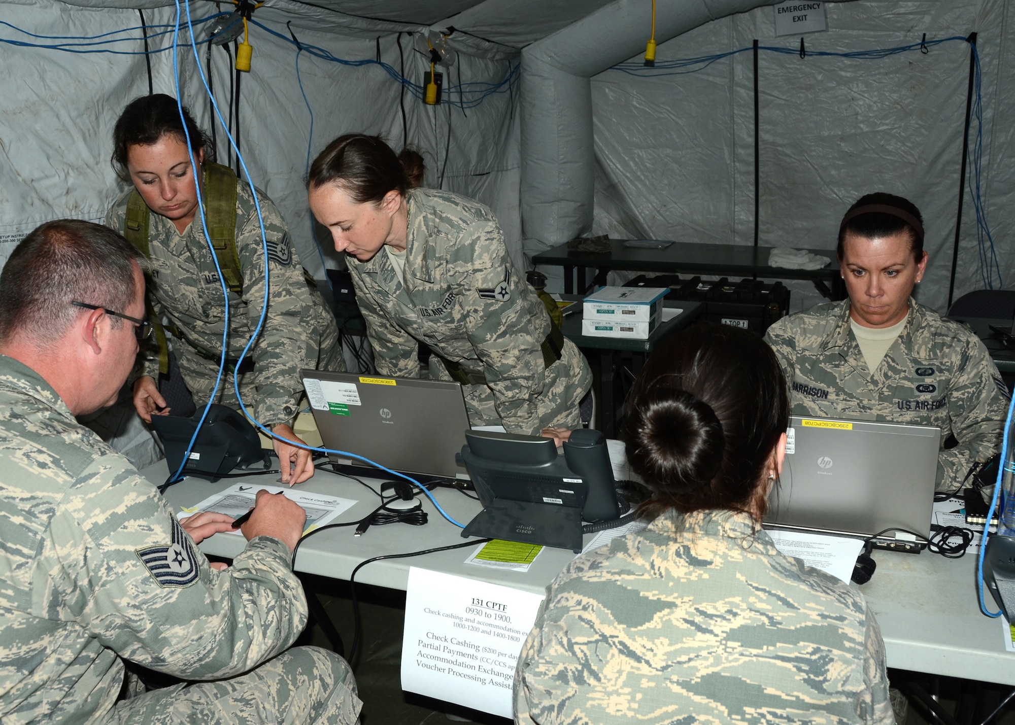 The 239th Combat Communications Squadron, Missouri Air National Guard, “deployed” from Jefferson Barracks, St. Louis, Missouri, to Whiteman Air Force Base, Missouri, for an exercise during the 131st Bomb Wing annual training week, June 16-20, 2014.   Citizen-Airmen of the 131st Bomb Wing Comptroller Flight also participated in the exercise, with members running mock scenarios while using equipment and workspace provided by the 239th. (U.S. Air National Guard photo by Airman Halley Burgess)
