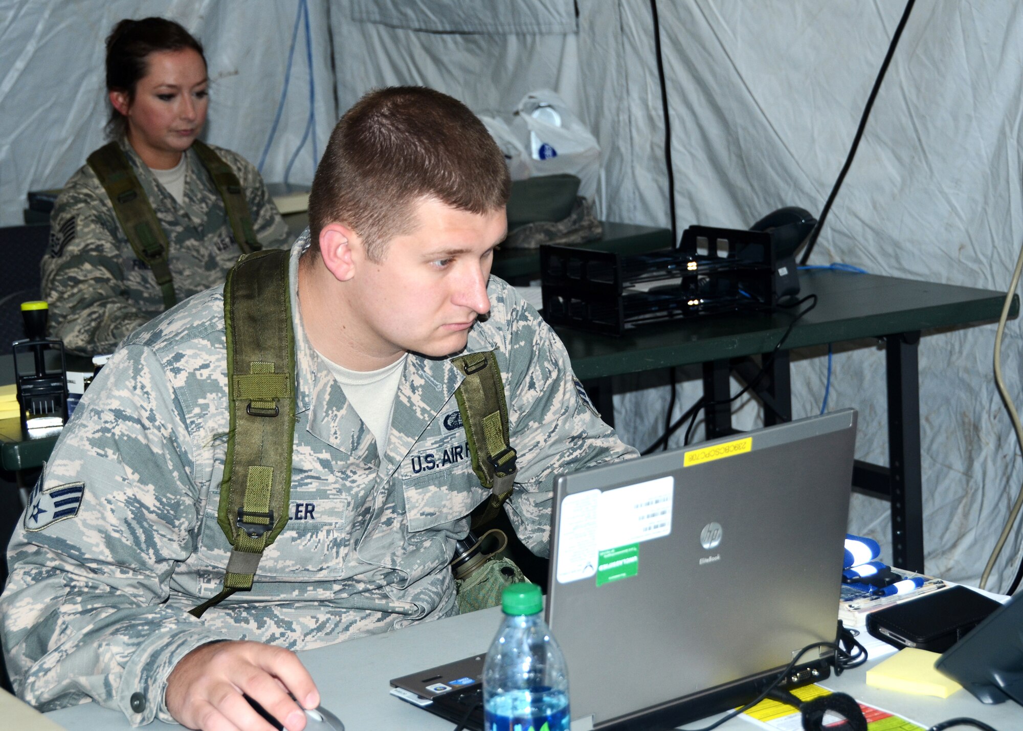 The 239th Combat Communications Squadron, Missouri Air National Guard, “deployed” from Jefferson Barracks, St. Louis, Missouri, to Whiteman Air Force Base, Missouri, for an exercise 131st Bomb Wing annual training week June 16-20, 2014.  Citizen-Airmen of the 131st Bomb Wing Comptroller Flight also participated in the exercise, with members running mock scenarios while using equipment and workspace provided by the 239th. (U.S. Air National Guard photo by Staff Sgt. Brittany Cannon)