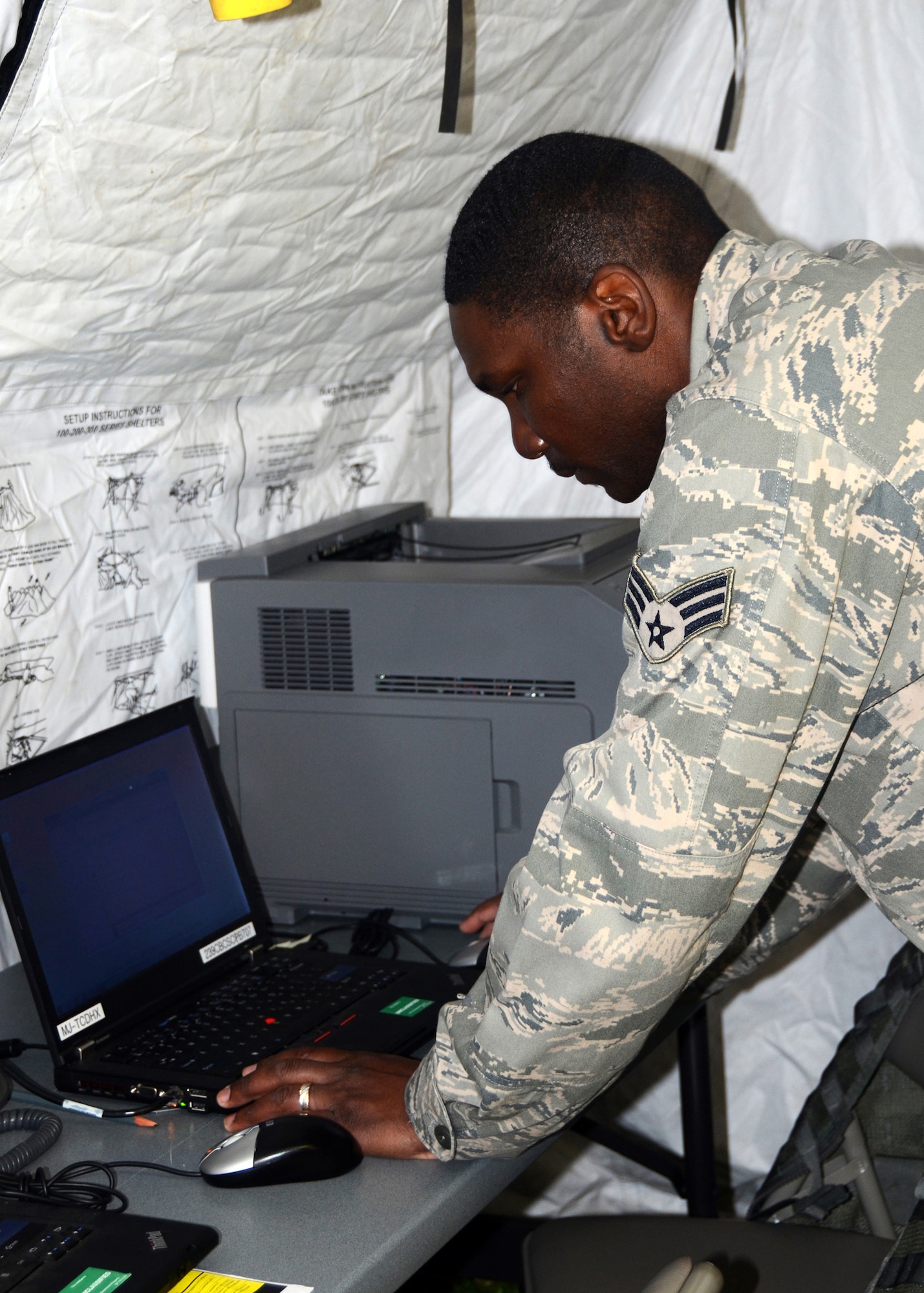 The 239th Combat Communications Squadron, Missouri Air National Guard, “deployed” from Jefferson Barracks, St. Louis, Missouri, to Whiteman Air Force Base, Missouri, for an exercise during the 131st Bomb Wing annual training week, June 16-20, 2014.   Citizen-Airmen of the 131st Bomb Wing Comptroller Flight also participated in the exercise, with members running mock scenarios while using equipment and workspace provided by the 239th. (U.S. Air National Guard photo by Staff Sgt. Brittany Cannon)