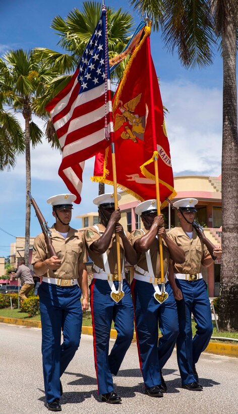 A Marine Corps color guard detail marches June 15 at Saipan during a parade for the 70th Anniversary Reunion of Honor. The celebration marked a milestone of peace in the region and paid tribute to both U.S. and Japan veterans of the battles of Saipan and Tinian during World War II. The Marines are with 3rd Marine Division, III Marine Expeditionary Force.