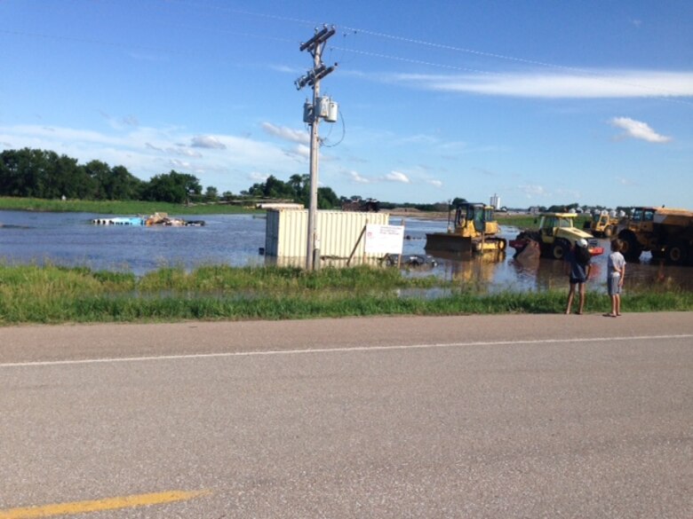 Lowland flooding caused by severe storms during the weekend of June 20, 2014 inundated the Shell Creek levee construction staging area in Schuyler, Neb.