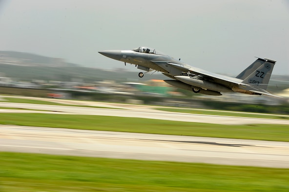 A 44th Fighter Squadron F-15C Eagle takes off from Kadena Air Base, Japan, June 18, 2014, for aviation training relocation to Andersen Air Force Base, Guam. The ATR provides service members from Kadena AB the opportunity to integrate with Pacific Air Forces units in the region and strengthen the Air Force's ability to respond to a potential threat in the region. The repositioning also relieves the noise impact of Kadena AB jets on the local community. (U.S. Air Force photo/Senior Airman Maeson L. Elleman)