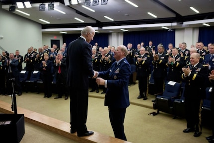 ice President Joe Biden shakes hands with Air Force Gen. Craig McKinley, chief of the National Guard Bureau, after speaking to National Guard adjutants general meeting at the White House, Feb. 29, 2012.