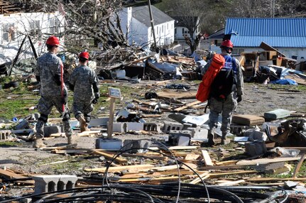 Kentucky National Guard service members engage in a search and rescue mission in West Liberty, Ky., for survivors after torrential storms and violent winds destroyed much of the community there, March 2, 2012.