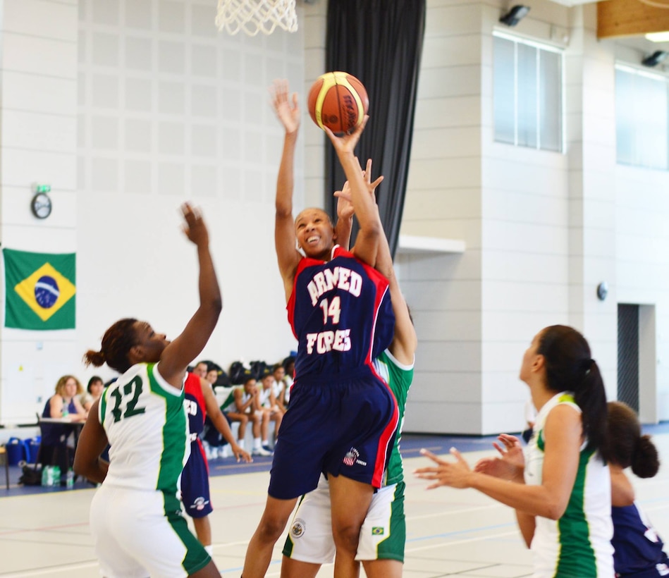 Army SPC Danielle Salley drives the rim over Brazil.  The U.S. Armed Forces Women’s Basketball team competed in the 2014 Conseil International du Sport Militaire (CISM) Basketball Championship in Meyenheim, France from 15-22 June.