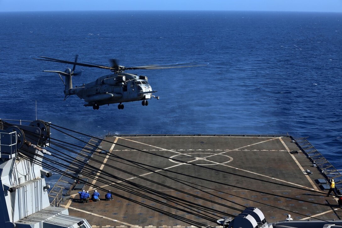 A CH-53E Super Stallion with Marine Medium Tiltrotor Squadron 163, 11th Marine Expeditionary Unit, prepares to land aboard the USS Comstock during Certification Exercise (CERTEX) off the coast of Southern California, June 19. CERTEX is comprised of a specific series of missions intended to evaluate and certify the 11th MEU for their upcoming deployment with the Makin Island Amphibious Ready Group scheduled for later this summer. (U.S. Marine Corps photo by Sgt. Melissa Wenger/Released)