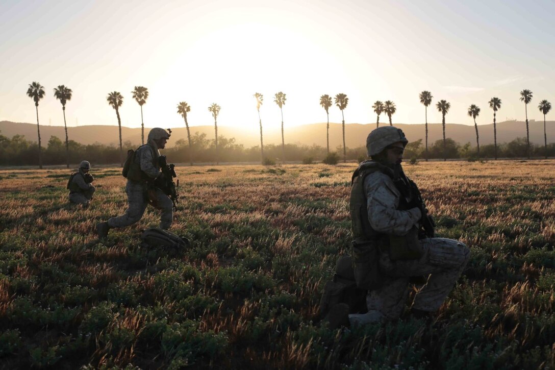 Marines with Weapons Company, Battalion Landing Team 2nd Battalion, 1st Marines, 11th Marine Expeditionary Unit, maintain security as part of a tactical recovery of aircraft and personnel training exercise during Certification Exercise (CERTEX) aboard Marine Corps Base Camp Pendleton, California, June 20, 2014. CERTEX is the final evaluation of the 11th MEU and Makin Island Amphibious Ready Group prior to deployment. The evaluation requires the Marines and sailors to plan and conduct integrated missions simulated to reflect real-world operations. (U.S. Marine Corps photo by Lance Cpl. Evan R. White/RELEASED)