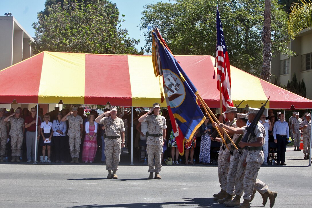 Navy Capt. Theodore P. Briski (left), incoming commanding officer, 1st Medical Battalion, 1st Marine Logistics Group and Navy Capt. James A. LeTexier salute the colors during the change of command ceremony aboard Camp Pendleton, Calif., June 17, 2014. LeTexier passed on command of the battalion to Briski, who recently served as the executive officer of Naval Hospital Lemoore, Calif.