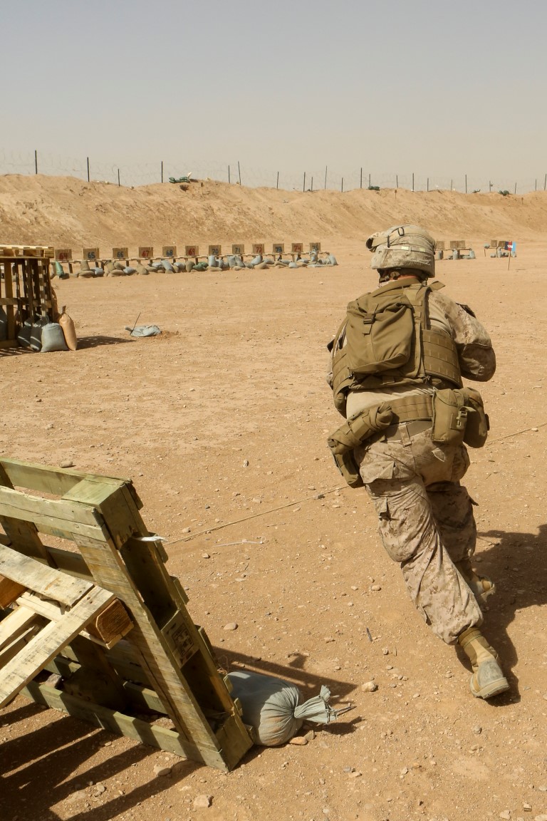 Lance Cpl. Jonathan Hance, a machine gunner with 1st Battalion, 2nd Marine Regiment, and a Hickory, N.C., native, runs to the next firing position during a combat marksmanship range held aboard Camp Leatherneck, Helmand province, Afghanistan, June 20, 2014. Ranges such as this one keep Marines like Hance, a Hickory, N.C., native, on top of their shooting skills and give them the confidence they need while on a patrol. (U.S. Marine Corps photo by Cpl. Michael Dye/released)