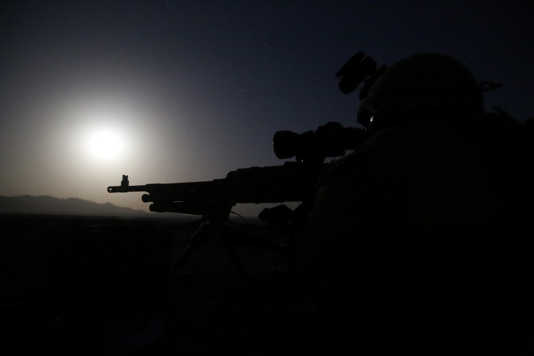 Lance Cpl. Alan Revilla, machine gunner, Weapons Company, 1st Battalion, 7th Marine Regiment, mans a M240B medium machine gun throughout the night from a security post during a mission in Helmand province, Afghanistan, June 13, 2014. Revilla, a native of Houston, along with a platoon of infantrymen, provided security at Patrol Base Ouellette, an Afghan National Army controlled-base, during the Afghanistan presidential runoff elections. While International Security Assistance Force stood ready to support as needed, the elections were entirely Afghan led and Afghan conducted.