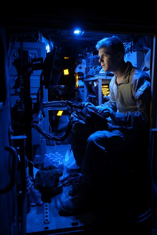 Corporal Mark Rood, cyber network operator, Headquarters and Service Company, 1st Battalion, 7th Marine Regiment, maintains network connectivity during a mission in Helmand province, Afghanistan, June 13, 2014. Rood, a native of Doylestown, Penn., along with a platoon of infantrymen, provided security at Patrol Base Ouellette, an Afghan National Army controlled-base, during the Afghanistan presidential runoff elections. While International Security Assistance Force stood ready to support as needed, the elections were entirely Afghan led and Afghan conducted.