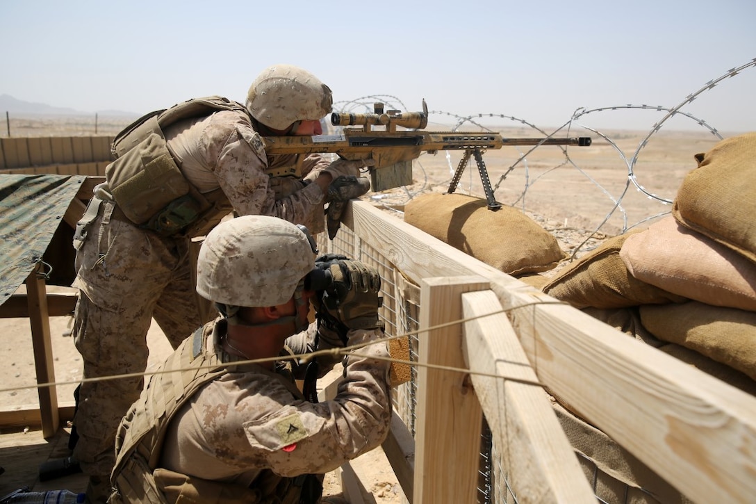 Marines with Scout Sniper Platoon, 1st Battalion, 7th Marine Regiment, man security positions during a mission in Helmand province, Afghanistan, June 13, 2014. The infantrymen provided security at Patrol Base Ouellette, an Afghan National Army controlled-base, during the Afghanistan presidential runoff elections. While International Security Assistance Force stood ready to support as needed, the elections were entirely Afghan led and Afghan conducted.