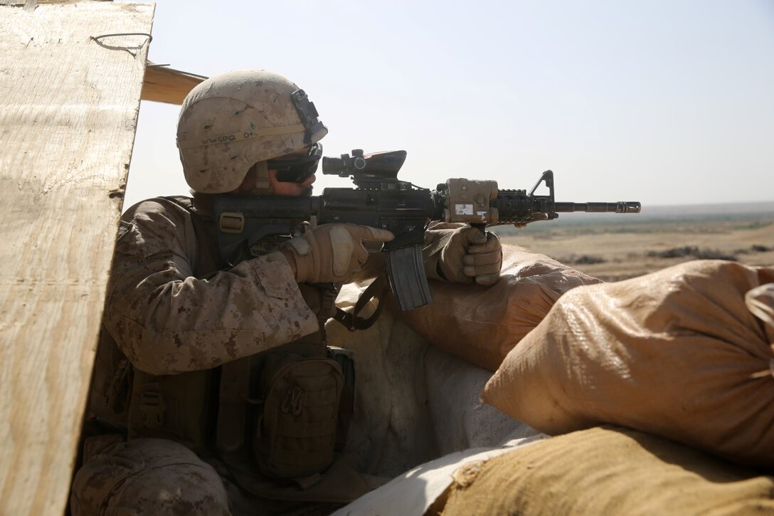 Lance Cpl. Jeffery Webb, anti-tank missileman, Weapons Company, 1st Battalion, 7th Marine Regiment, mans a security post during a mission in Helmand province, Afghanistan, June 13, 2014. Webb, a native of Montgomery, Texas, along with a platoon of infantrymen, provided security at Patrol Base Ouellette, an Afghan National Army controlled-base, during the Afghanistan presidential runoff elections. While International Security Assistance Force stood ready to support as needed, the elections were entirely Afghan led and Afghan conducted.