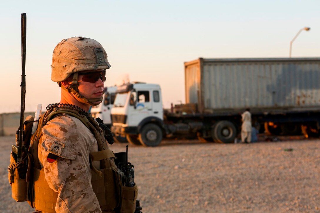 Corporal Zachary Minick, a squad leader with 1st Battalion, 2nd Marine Regiment, and a Hickory, N.C., native, ensures all drivers at the main entry point exit their vehicle prior to conducting a thorough search aboard Camp Leatherneck, Helmand province, Afghanistan, June 20, 2014.  The Marines at the main entry point are responsible for thoroughly searching all vehicles before they enter the base. (U.S. Marine Corps photo by Cpl. Michael Dye/released)