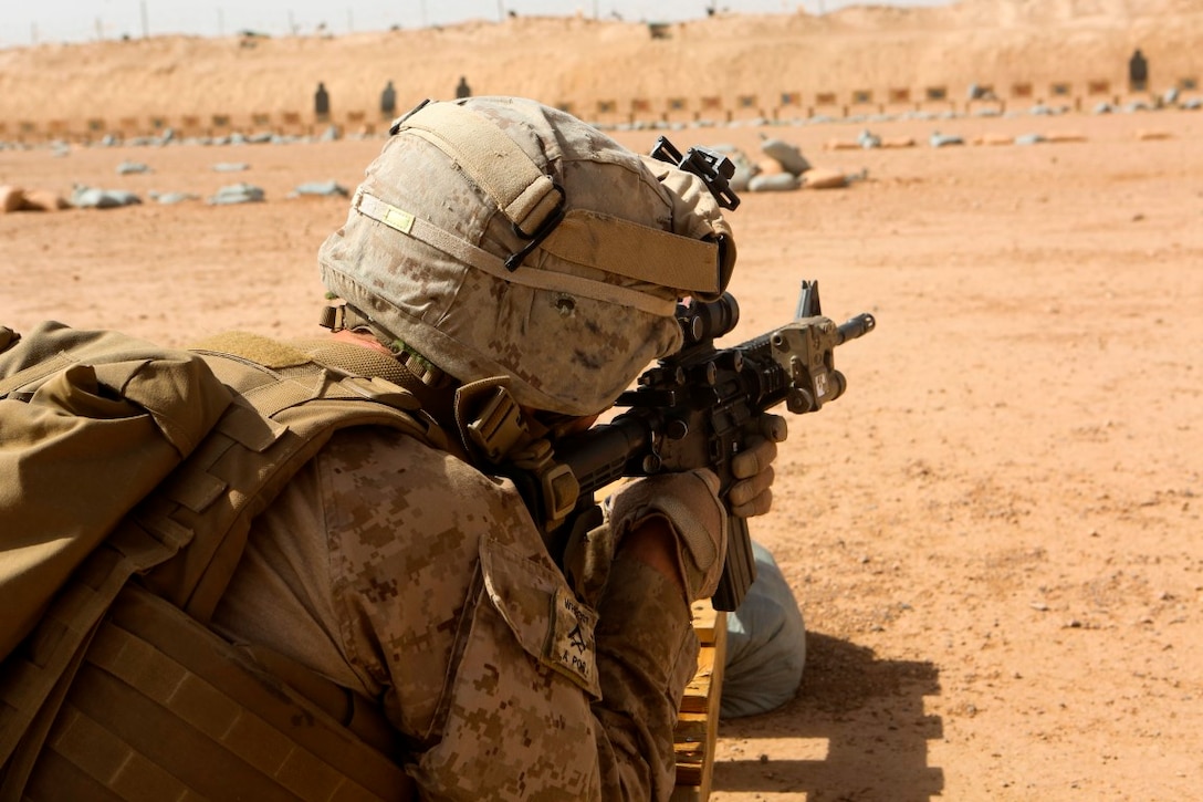 Lance Cpl. Jonathan Hance, a machine gunner with 1st Battalion, 2nd Marine Regiment, fires his rifle during a combat marksmanship range held aboard Camp Leatherneck, Helmand province, Afghanistan, June 20, 2014. Ranges such as this one keep Marines like Hance, a Hickory, N.C., native, on top of their shooting skills and give them the confidence they need while on a patrol. (U.S. Marine Corps photo by Cpl. Michael Dye/released)