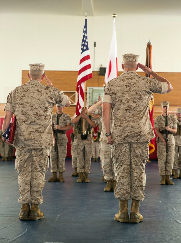 Sgt. Maj. Lee D. Bonar, left, and Lt. Gen. John Wissler salute the national flags of Japan and the U.S. during the post, relief and retirement of Sgt. Maj. Steven D. Morefield June 17 at Camp Hansen. Morefield served in the Marine Corps for 32 years and was the III Marine Expeditionary Force sergeant major from June 2011 to June 2014. Bonar is the new III MEF sergeant major, and Wissler is the commanding general of III MEF.