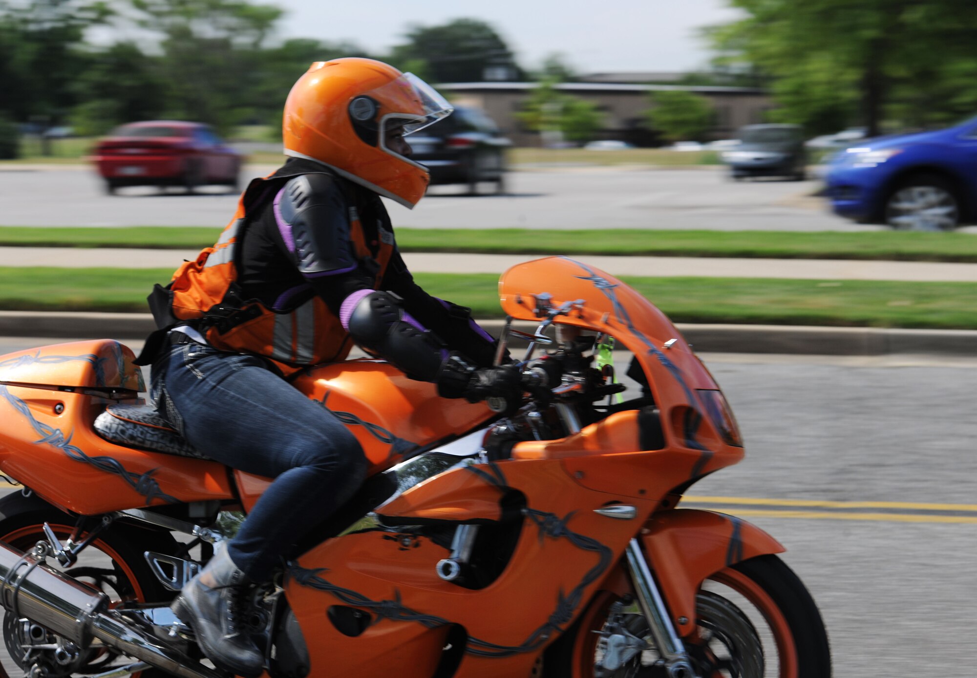 Tech. Sgt. Stephanie Jones, 779th Dental Squadron dental lab NCO in-charge, rides her motorcycle during the Annual Motorcycle Safety Day on Joint Base Andrews, Md., June 20, 2014. (U.S. Air Force photo/Airman 1st Class Ryan J. Sonnier)