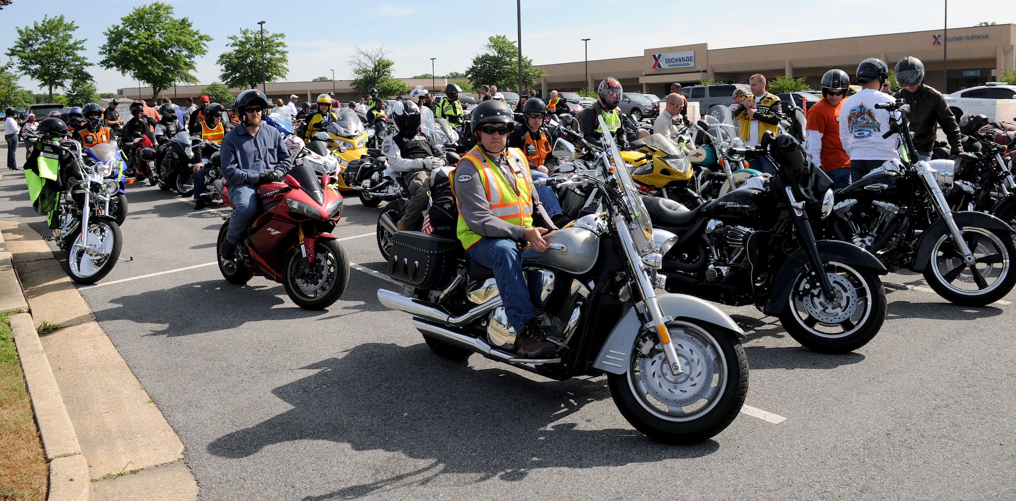 Team Andrews members prepare for the escorted off-base motorcycle ride during the 4th Annual Motorcycle Safety Day on Joint Base Andrews, Md., June 20, 2014. The event provided demonstrations and safety tips to help reduce accidents among riders. (U.S. Air Force photo/Airman 1st Class Ryan J. Sonnier)