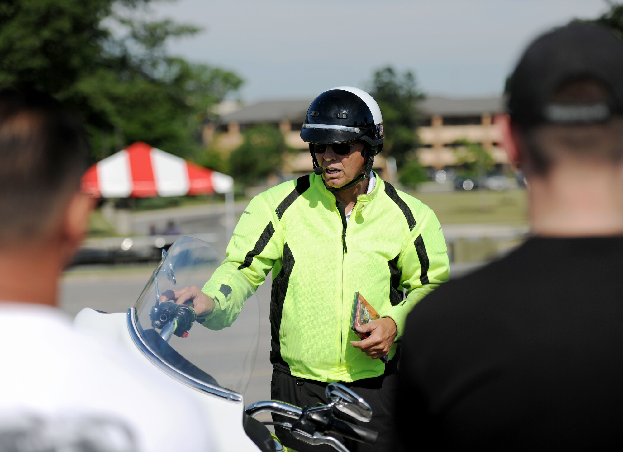 Dave Russell, owner and instructor of Ride Like a Pro of Maryland, instructs viewers on how to properly and safely maneuver a motorcycle at low speeds. The demonstration was part of the 4th Annual Motorcycle Safety Day on Joint Base Andrews, Md., June 20, 2014. (U.S. Air Force photo/Airman 1st Class Ryan J. Sonnier)