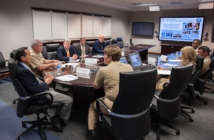 Cmdr. Marcia Ziemba, SPAWAR Systems Center Atlantic executive officer (center), briefs the Honorable Roger Natsuhara, Acting Assistant Secretary of the Navy for Energy, Installations and Environment (left), during a visit to Joint Base Charleston - Weapons Station, June 23, 2014. Natsuhara visited SSC Atlantic to learn about the command vision. SSC Atlantic delivers and supports solutions that enable Information dominance for our U.S. warfighters. (U.S. Navy photo/Joe Bullinger)

