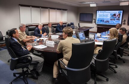 Cmdr. Marcia Ziemba, SPAWAR Systems Center Atlantic executive officer (center), briefs the Honorable Roger Natsuhara, Acting Assistant Secretary of the Navy for Energy, Installations and Environment (left), during a visit to Joint Base Charleston - Weapons Station, June 23, 2014. Natsuhara visited SSC Atlantic to learn about the command vision. SSC Atlantic delivers and supports solutions that enable Information dominance for our U.S. warfighters. (U.S. Navy photo/Joe Bullinger)

