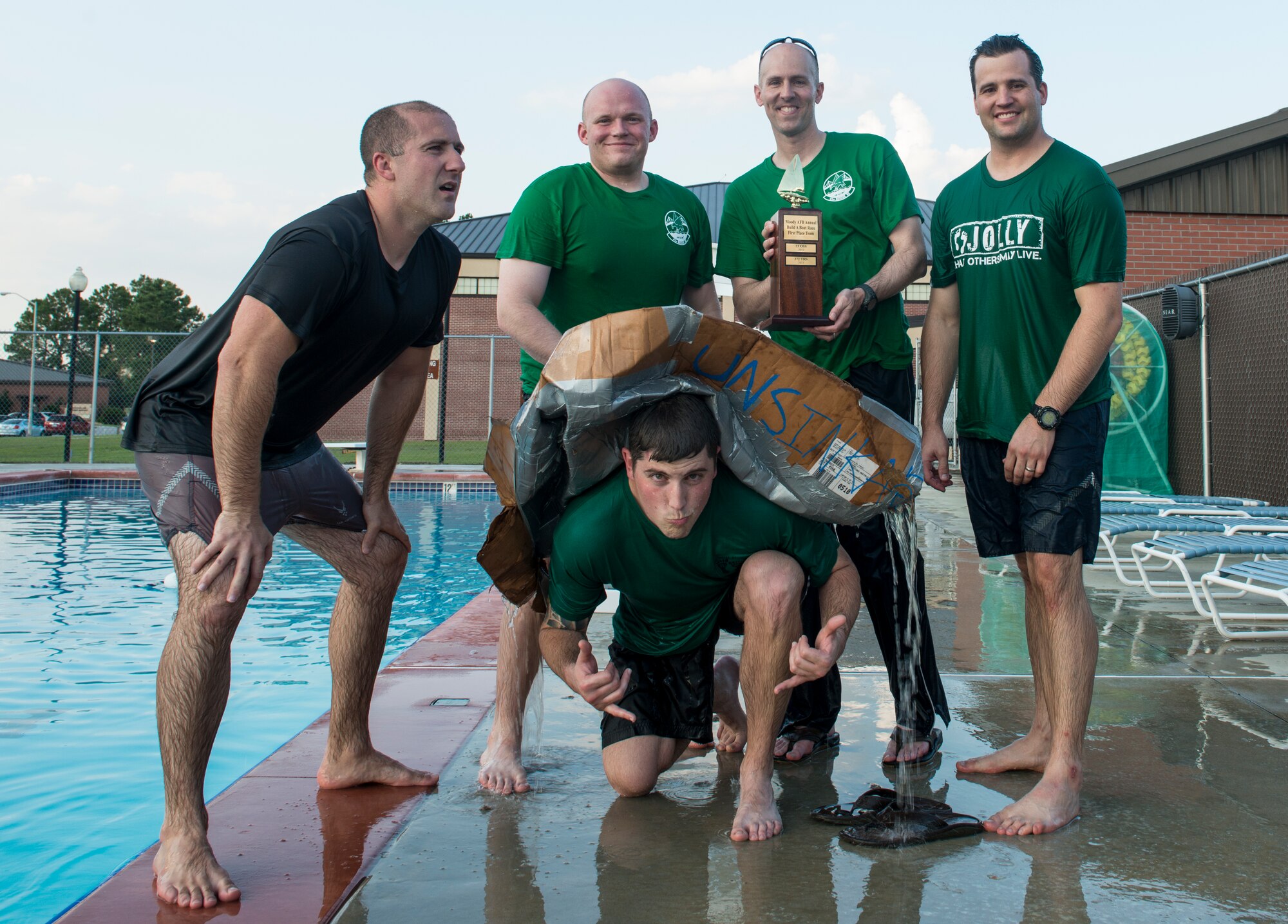 Members of the 41st Rescue Squadron pose for a photo after winning the 2014 Build a Boat competition at Moody Air Force Base, Ga., June 19, 2014. The 41st RQS team expertly created the fastest boat using only cardboard, duct tape and box cutters. (U.S. Air Force photo by Senior Airman Douglas Ellis/Released)

