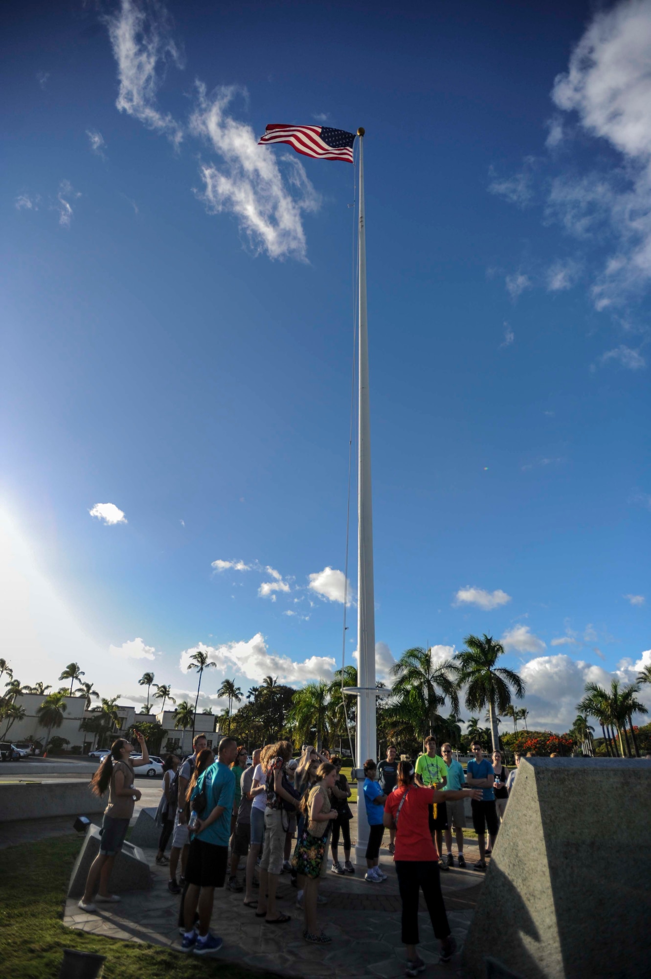 Jessie Higa, Hickam History Club president, explains the history of the Hickam Field Installation Flag Memorial to a group of local community members and honorary commanders during a walking tour of the historical sites on Hickam Field June 18, 2014. (U.S. Air Force photo/Tech. Sgt. Terri Paden)