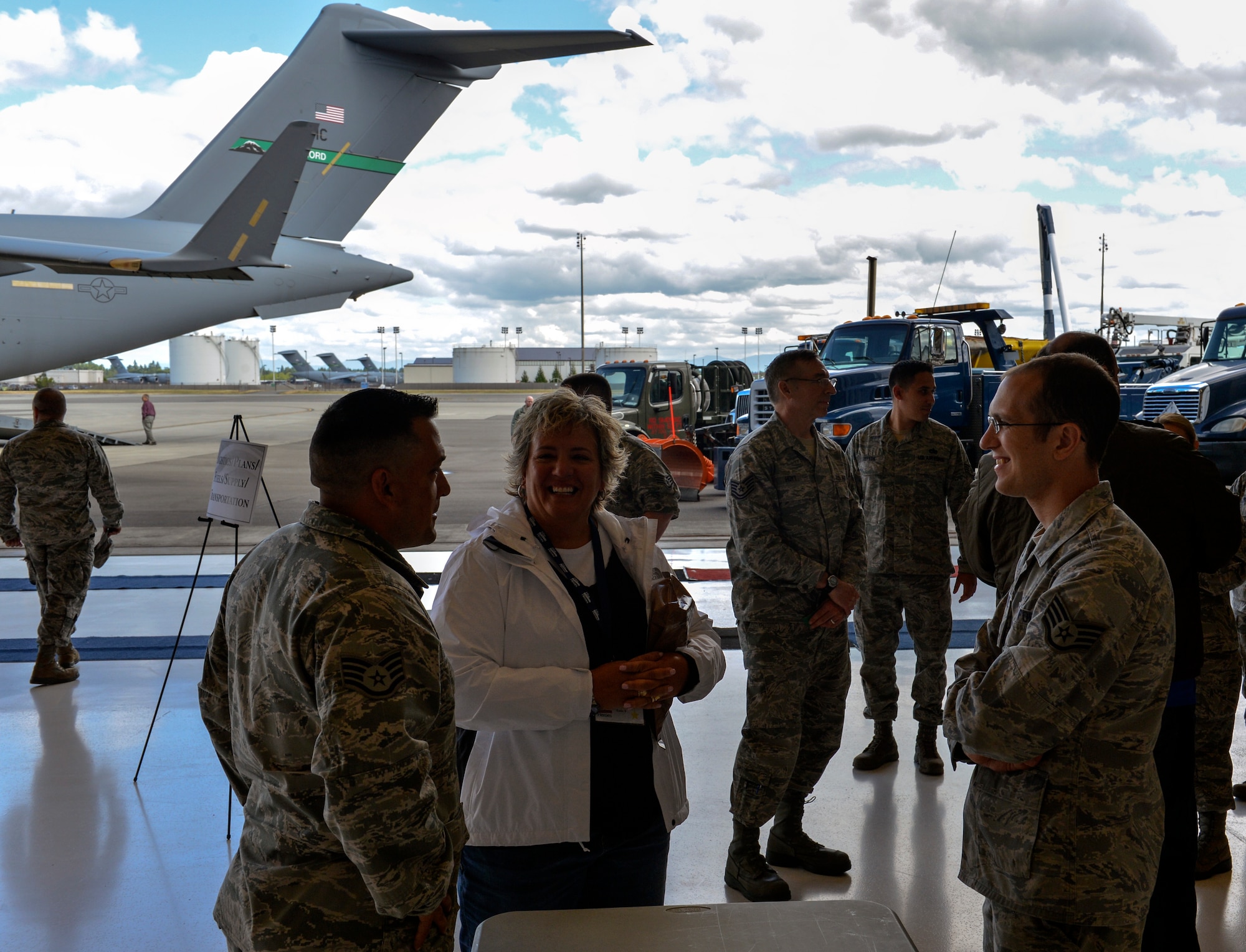 Staff Sgt. Robert Izzett (left), 62nd Aerial Port Squadron ramp services supervisor, and Staff Sgt. Stephen (right), Cooper 62nd APS cargo processing supervisor, describe their experiences as Airmen to Kelley Clayton, Starbucks Coffee representative at the Hire America’s Heroes Symposium June 20, 2014, at Joint Base Lewis-McChord, Wash. During the “Reverse Career Fair,” companies had the chance to learn firsthand what Team McChord Airmen do every day and what skills they have developed during their time in the Air Force. (U.S. Air Force photo/Staff Sgt. Russ Jackson)