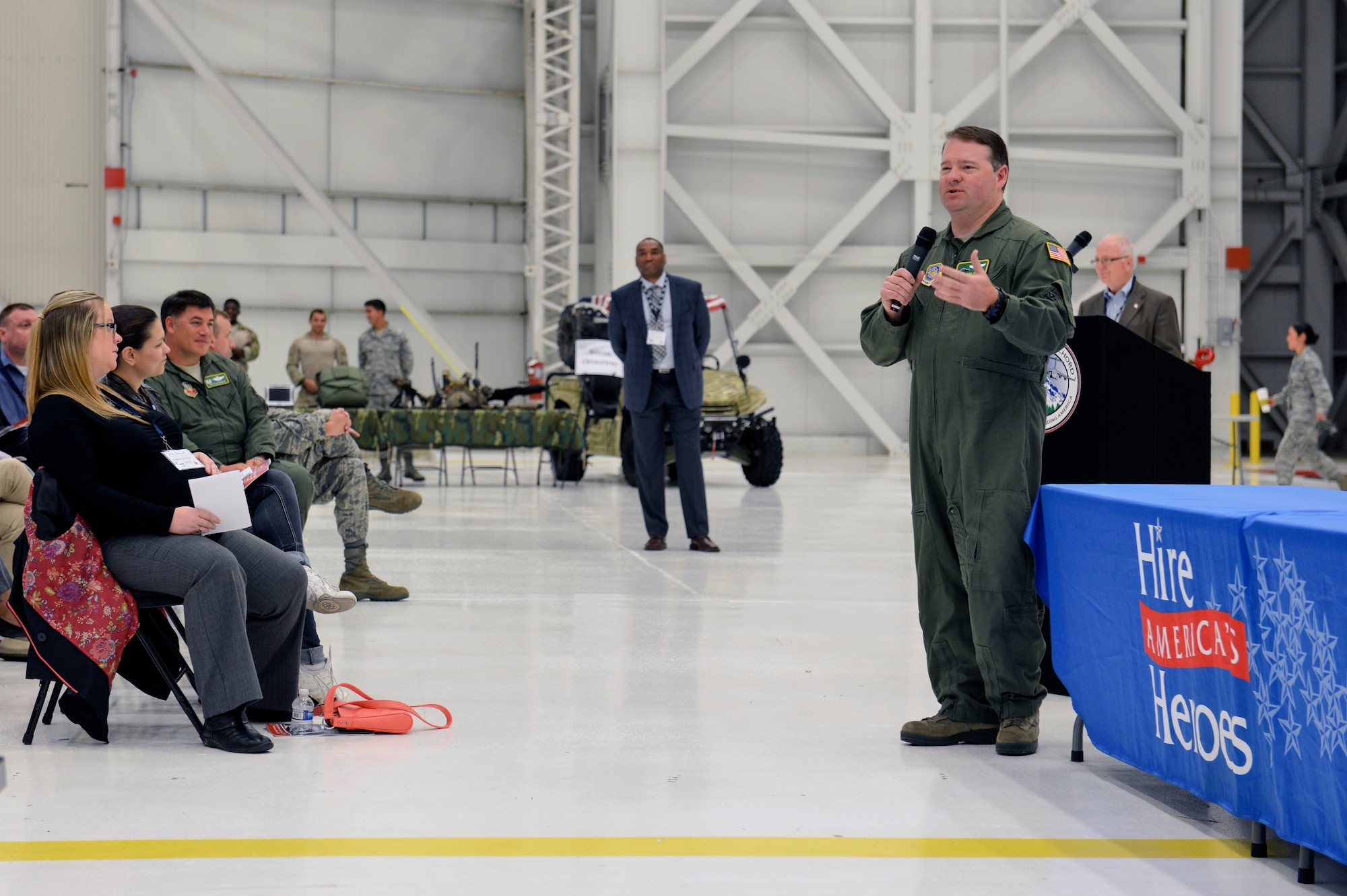Col. Jeff Philippart, 62nd Airlift Wing vice commander, welcomes more than 60 representatives from various companies to the Hire America’s Heroes Symposium June 20, 2014, at Joint Base Lewis-McChord, Wash. Philippart encouraged the company delegates to speak with Airmen in order to discover the qualities they search for in potential employees. (U.S. Air Force photo/Staff Sgt. Russ Jackson)