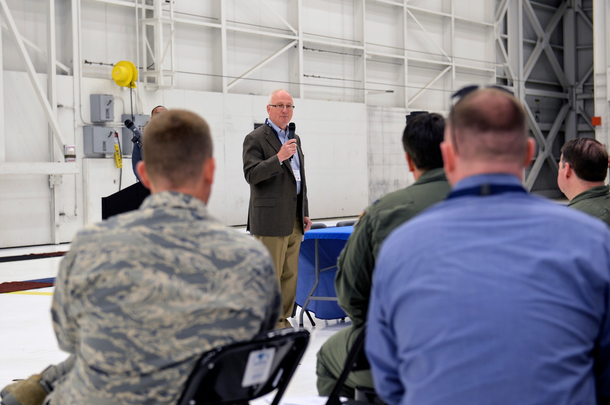 Retired Maj. Gen. James Collins, Hire America’s Heroes president, provides the opening remarks to kick off the Hire America’s Heroes Symposium June 20, 2014, at Joint Base Lewis-McChord, Wash. The symposium engaged more than 60 representatives from various companies introducing the skills of Team McChord Airmen for the purpose of employment in the corporate workforce. (U.S. Air Force photo/Staff Sgt. Russ Jackson)