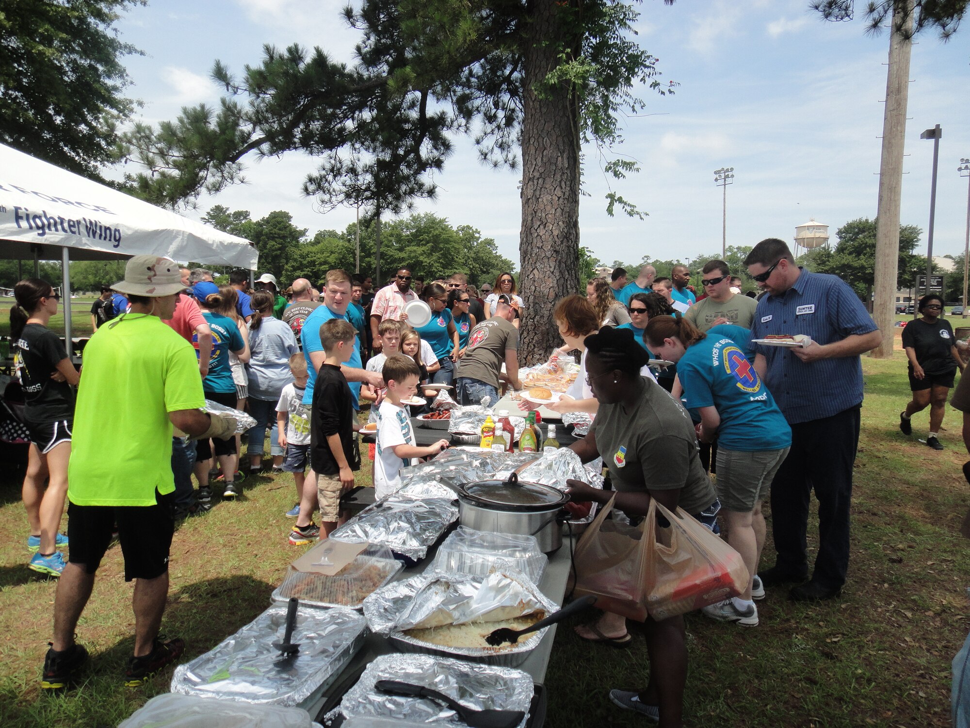 Members and families of the 20th Medical Group hit the food line during an annual picnic and sports day at Shaw Air Force Base, S.C., June 6, 2014. (Courtesy Photo)
