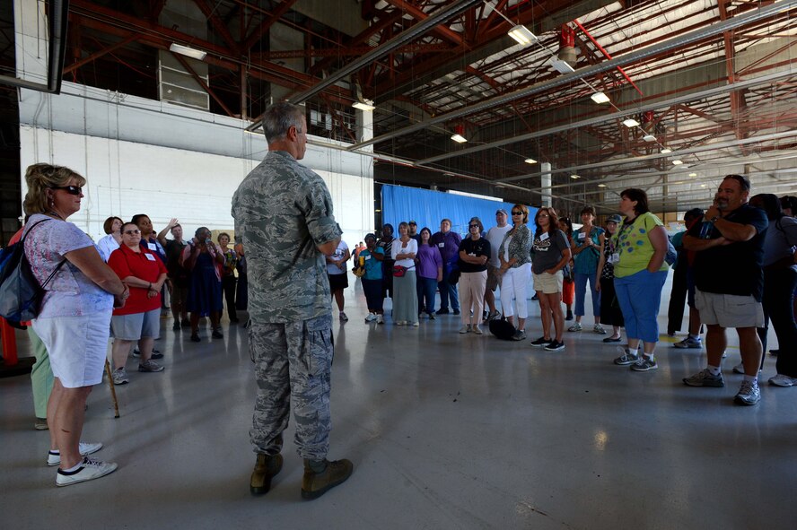 U.S. Air Force Col. William Jones, 20th Fighter Wing vice commander, briefs South Carolina school teachers on the capabilities of an F-16CJ Fighting Falcon at Shaw Air Force Base, S.C., June 19, 2014. Jones explained the process of becoming a fighter pilot so that the teachers could educate students on their potential Air Force careers. (U.S. Air Force photo by Airman 1st Class Jensen Stidham/Released)