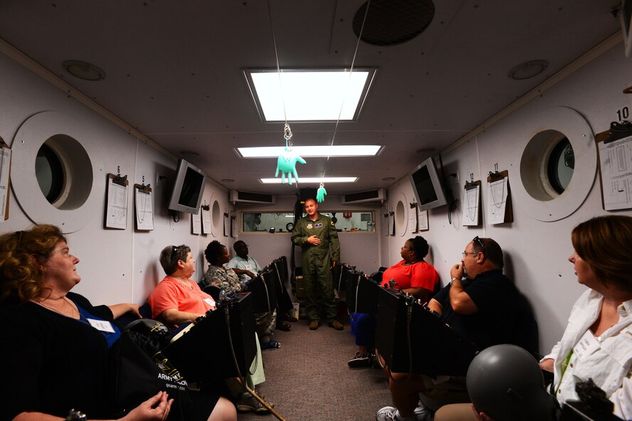U.S. Air Force Senior Airman Kyle Lang, 20th Aerospace Medicine Squadron hyperbaric chamber technician, talks with South Carolina school teachers on the training conducted in the chamber at Shaw Air Force Base, S.C., June 19, 2014. During their tour of the base, the teachers learned about several careers that the Air Force offers for high school and college graduates. (U.S. Air Force photo by Airman 1st Class Jensen Stidham/Released)  
