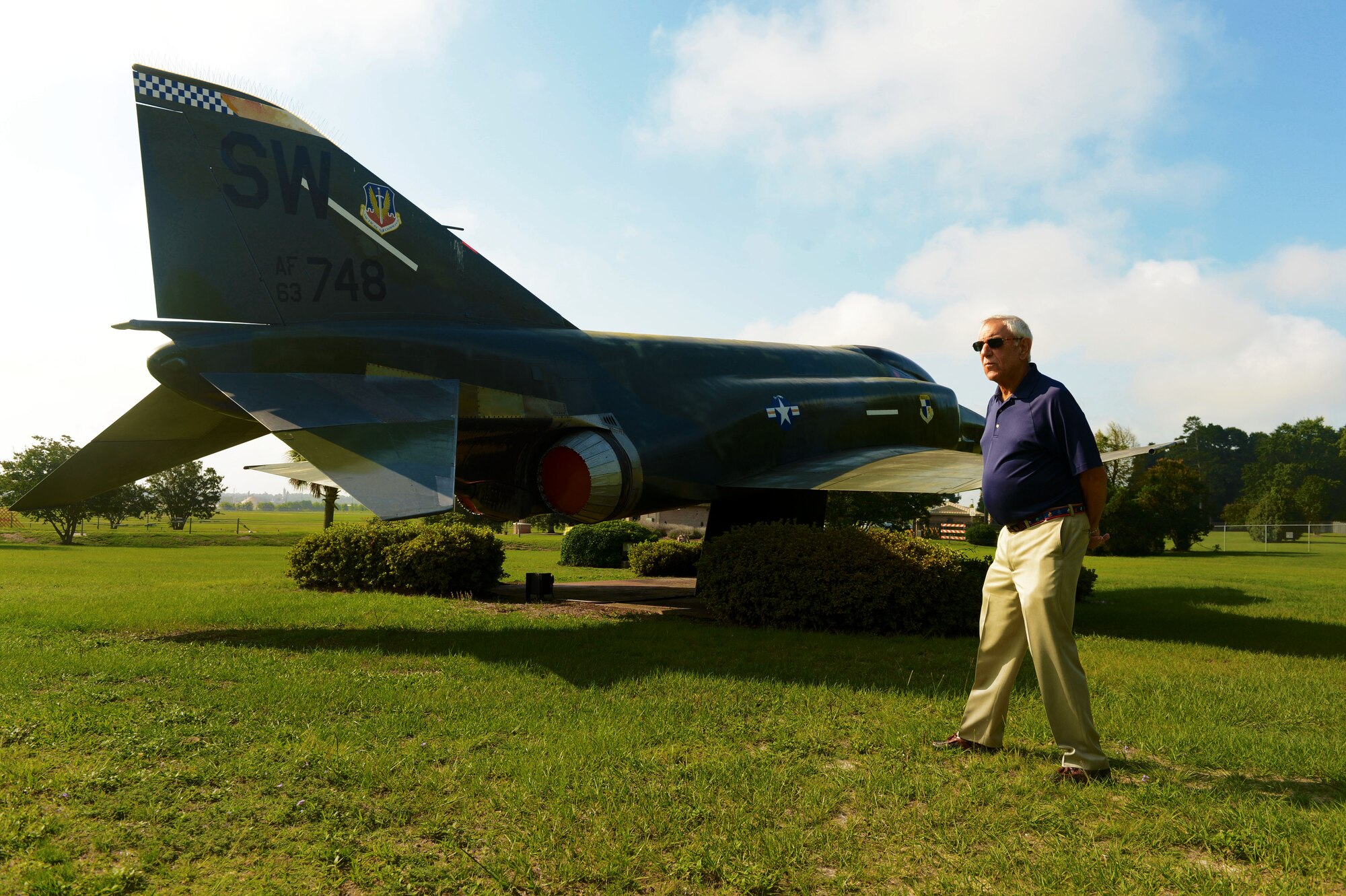 Former U.S. Air Force Capt. John Shinto walks around an F-5 Tiger while viewing the static aircraft displays at Shaw Air Force Base, S.C., June 16, 2014. Shinto flew in the Tiger several times between 1967 and 1969 while serving as a dentist for the 363rd Tactical Reconnaissance Wing at Shaw. (U.S. Air Force photo by Airman 1st Class Jensen Stidham/Released)
