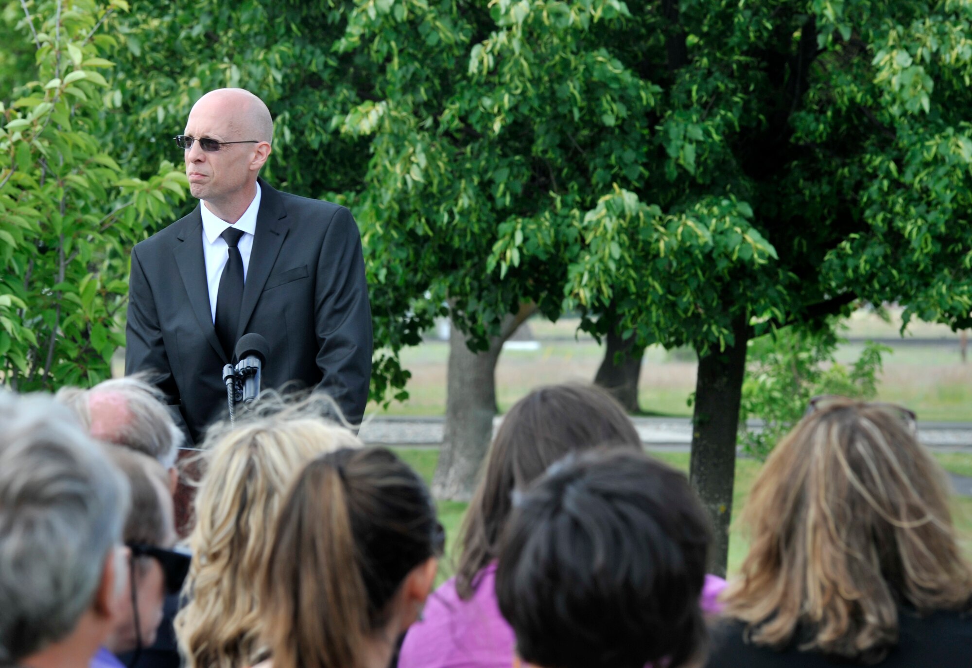 Retired Staff Sgt. Andrew Brown speaks during a memorial ceremony at Fairchild Air Force Base, Wash., June 20, 2014. The ceremony was held in remembrance of the hospital shooting here 20 years ago. Brown, who was assigned to the 92nd Security Forces Squadron at the time, stopped and killed the shooter, saving countless lives. Brown was awarded the Airman's Medal by President William Clinton. (U.S. Air Force photo by Senior Airman Mary O'Dell/Released)