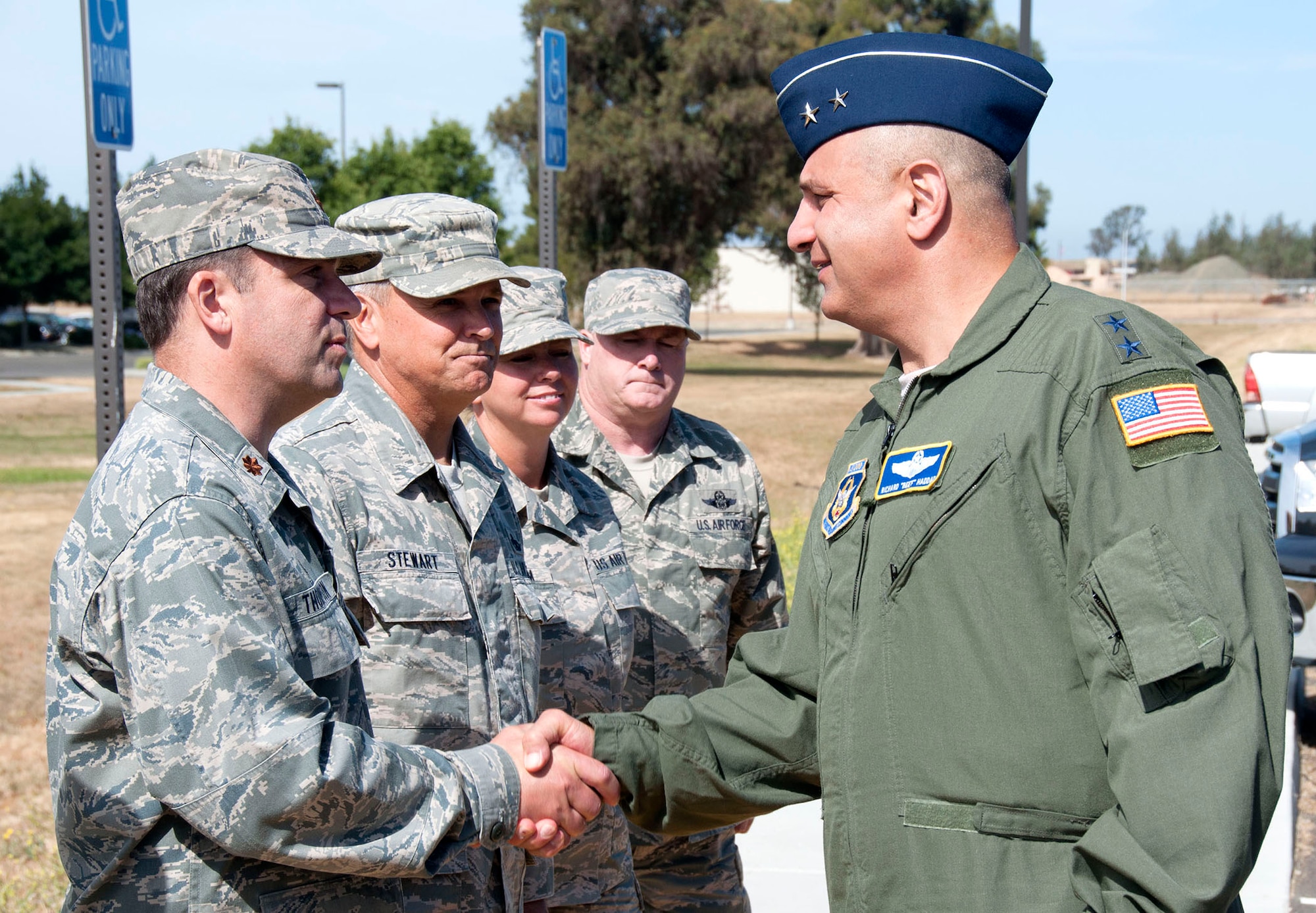 TRAVIS AIR FORCE BASE, Calif. -- Air Force Reserve Maj. Gen. Richard S. "Beef" Haddad (right), Air Force Reserve Command vice commander, shakes hands with 349th Air Mobility Wing personnel June 21, 2014 at Travis Air Force Base, Calif. From June 20-22, Haddad toured Travis Air Force Base, Calif., where he visited a number of facilities and meet with Airmen to gain a better understanding of air mobility innovations helping Travis AFB personnel deliver global mobility support for America anytime. (U.S. Air Force photo/Tech. Sgt. Stephen J. Collier)